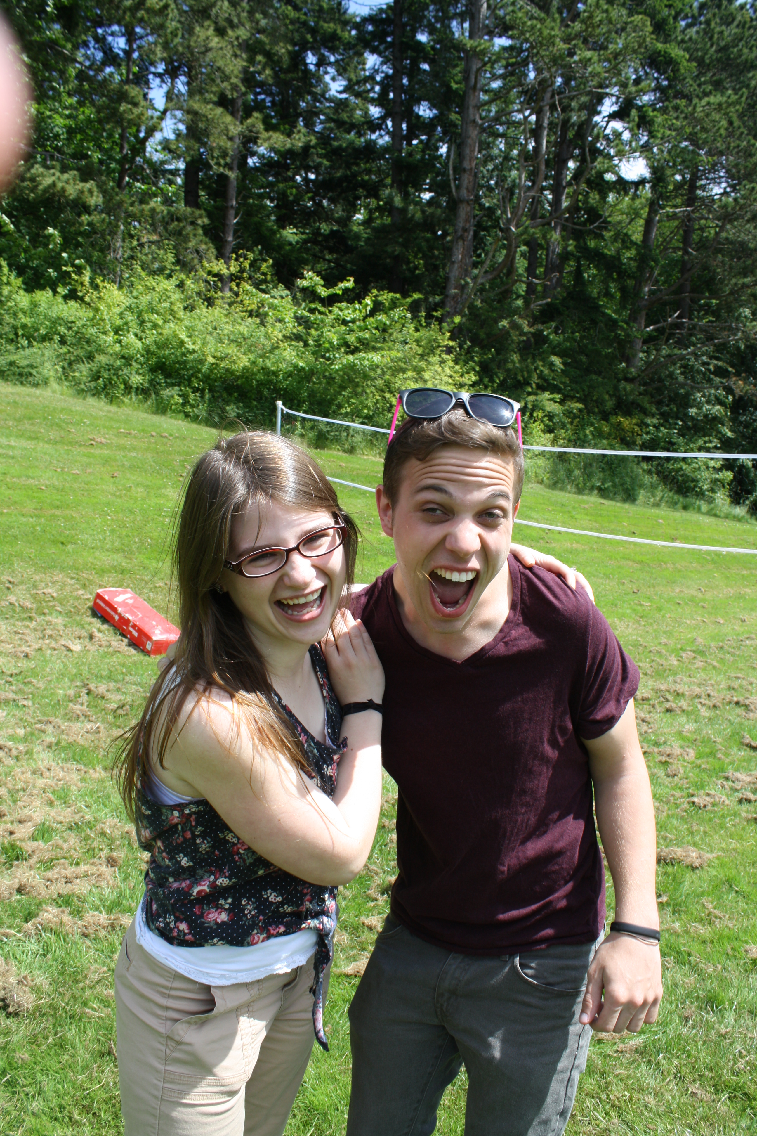 Lydia Love poses with man in maroon shirt.