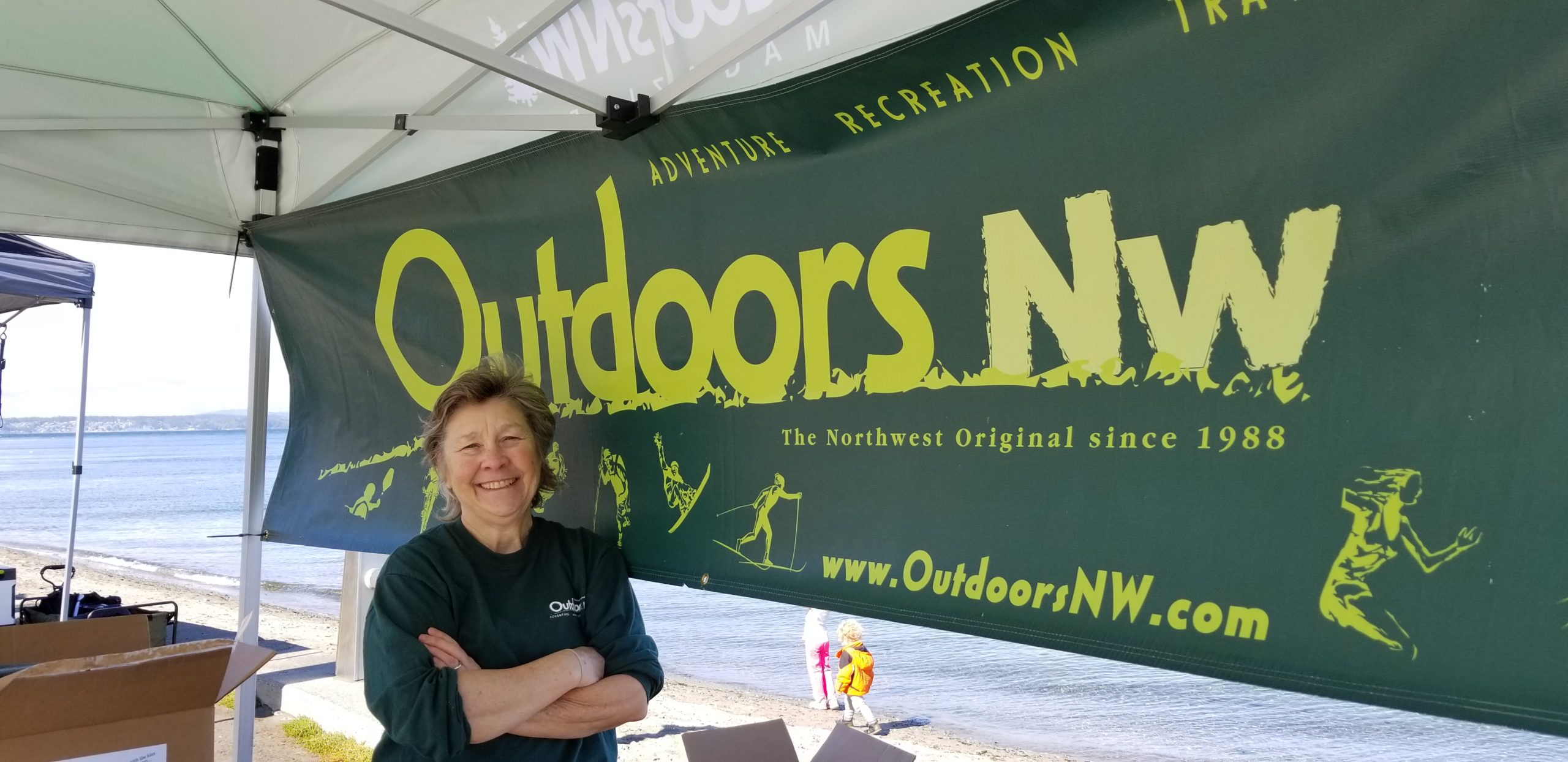 Carolyn Price at her booth for OutdoorsNW Magazine