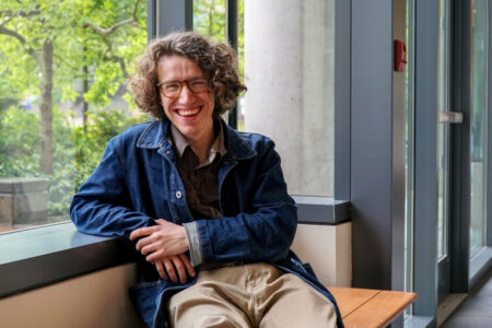 Questen Inghram sits for a portrait during a campus visit on May 28, 2024. Inghram, a 2023 news-ed grad, is working for the Yakima Herald-Republic with the support from the Murrow News Fellowship, an initiative of Washington State University that places reporters across the state of Washington to cover civic issues. Photo by Maylis Laverne