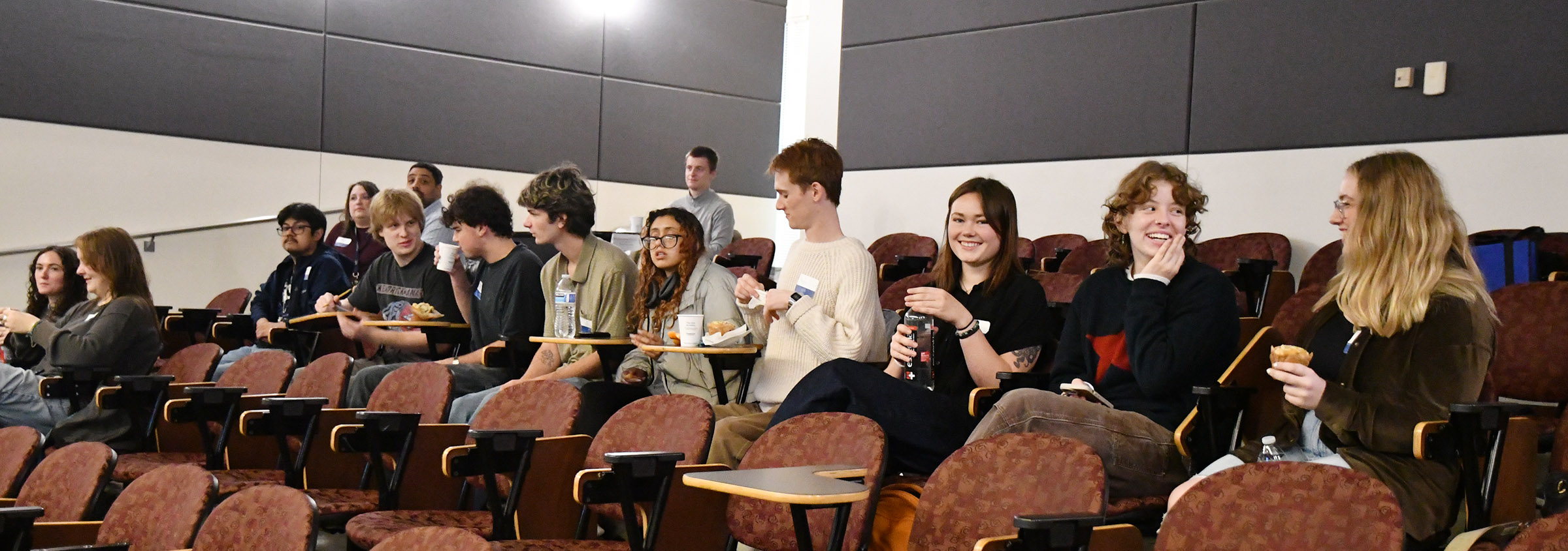 Students chat between presentations during Bellingham Visual.